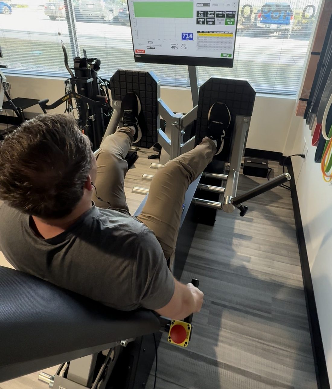 Working out on a leg press at the gym